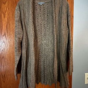 Tan ladies cardigan. Decorative flared pattern.
